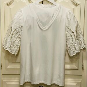 Chico’s white  knit top with beautiful eyelet sleeves. Sz 2. New.